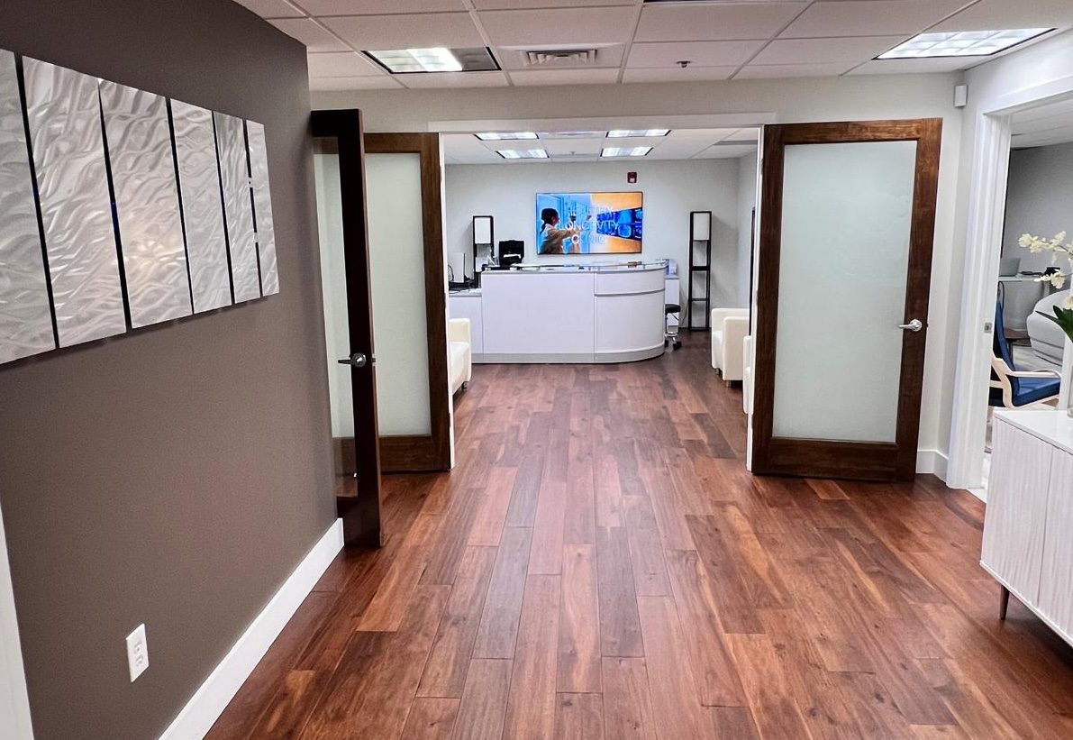 Hallway leading to the reception desk at Healthy Longevity Clinic Boca Raton.